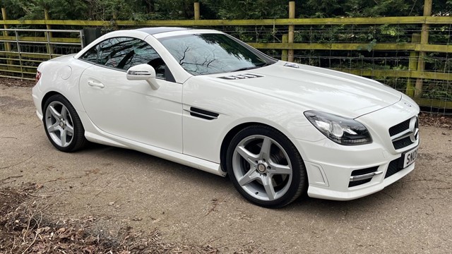2014 slk 250 cdi amg sport finished in white with black leather interior. a well-maintained example with  service history up... photo